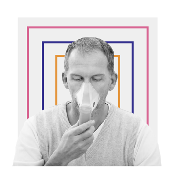 Man using oxygen inhaler