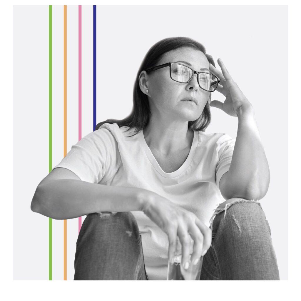 woman resting head in hand